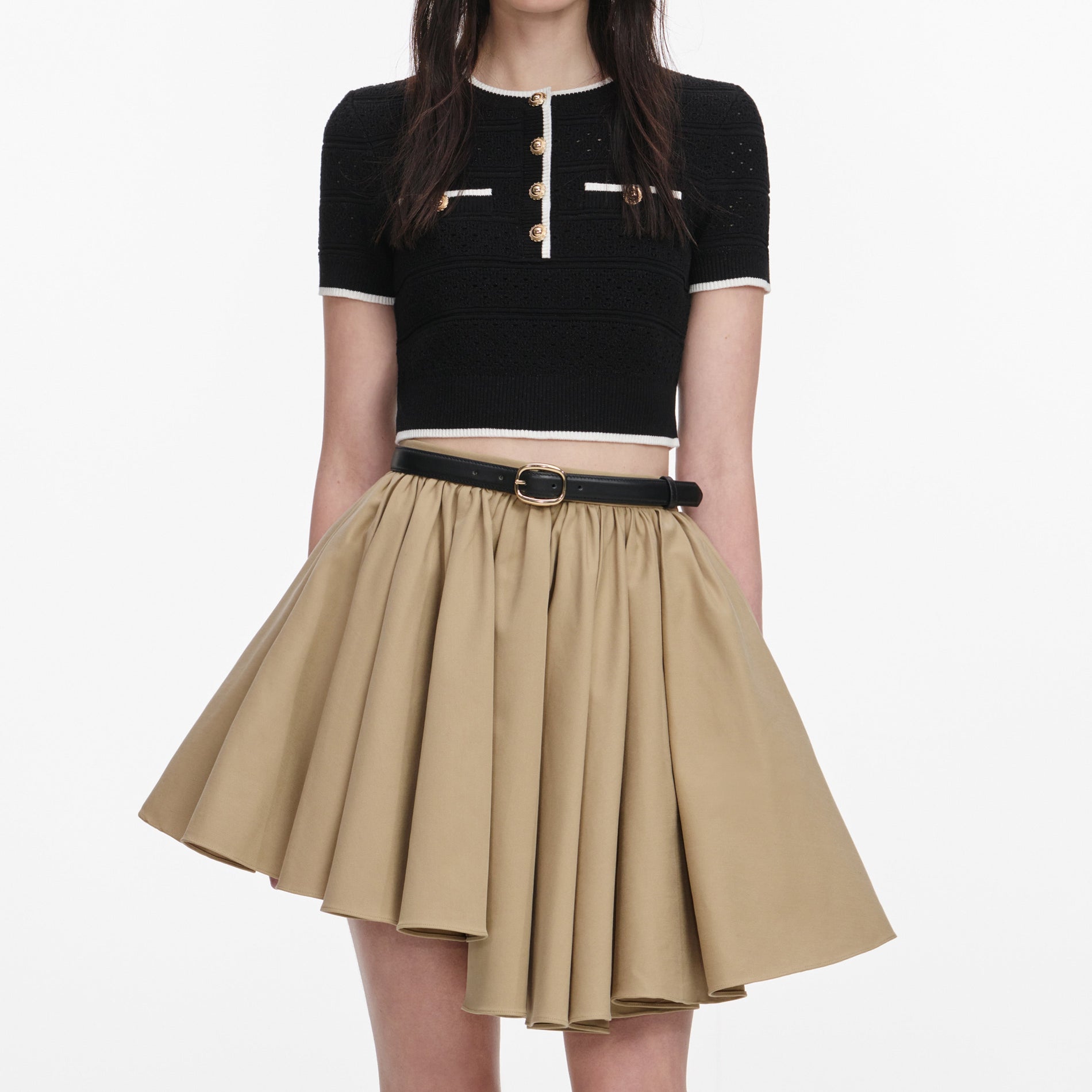 A close up of a woman wearing the Tan Cotton Mini Skirt