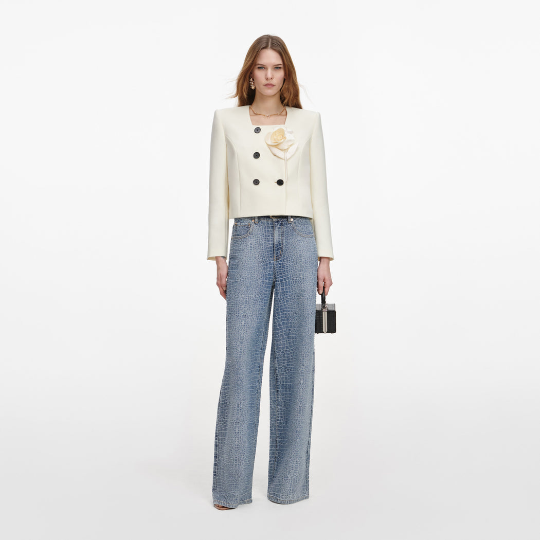 Front view of a woman wearing the Cream 3D Flower Jacket