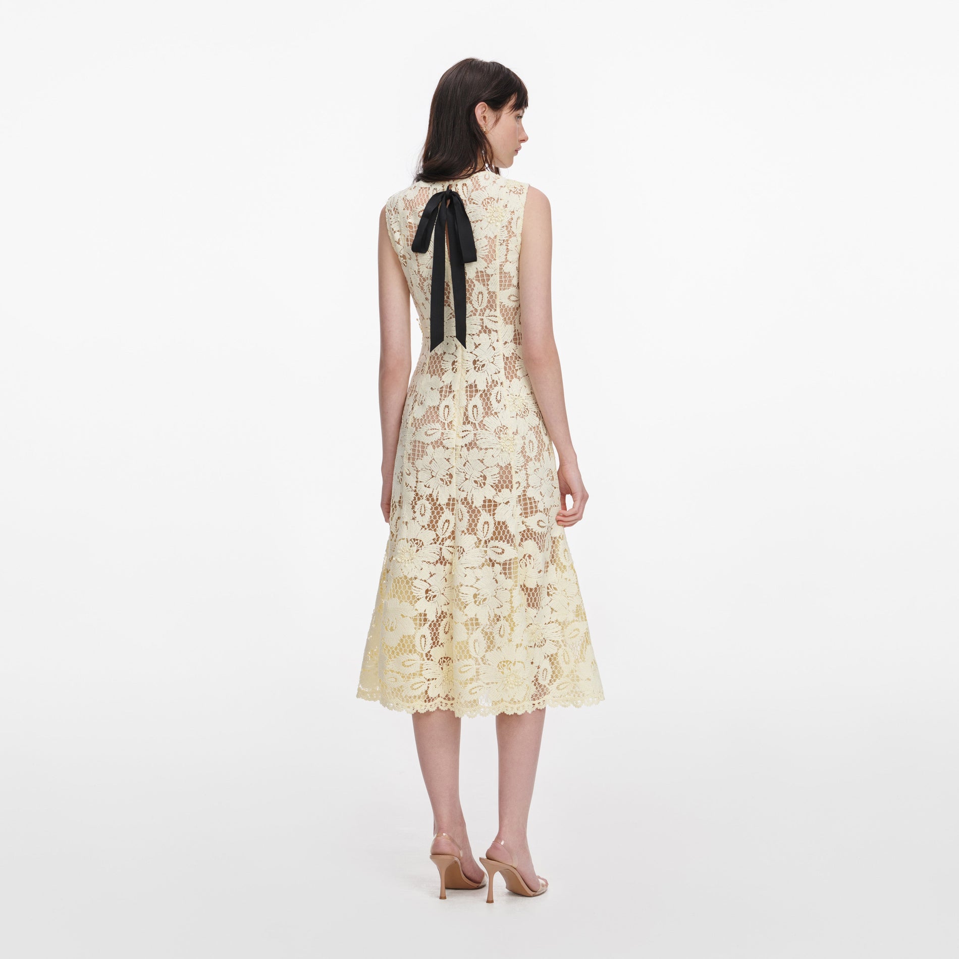 Back view of a woman wearing the Yellow Crochet Lace Midi Dress