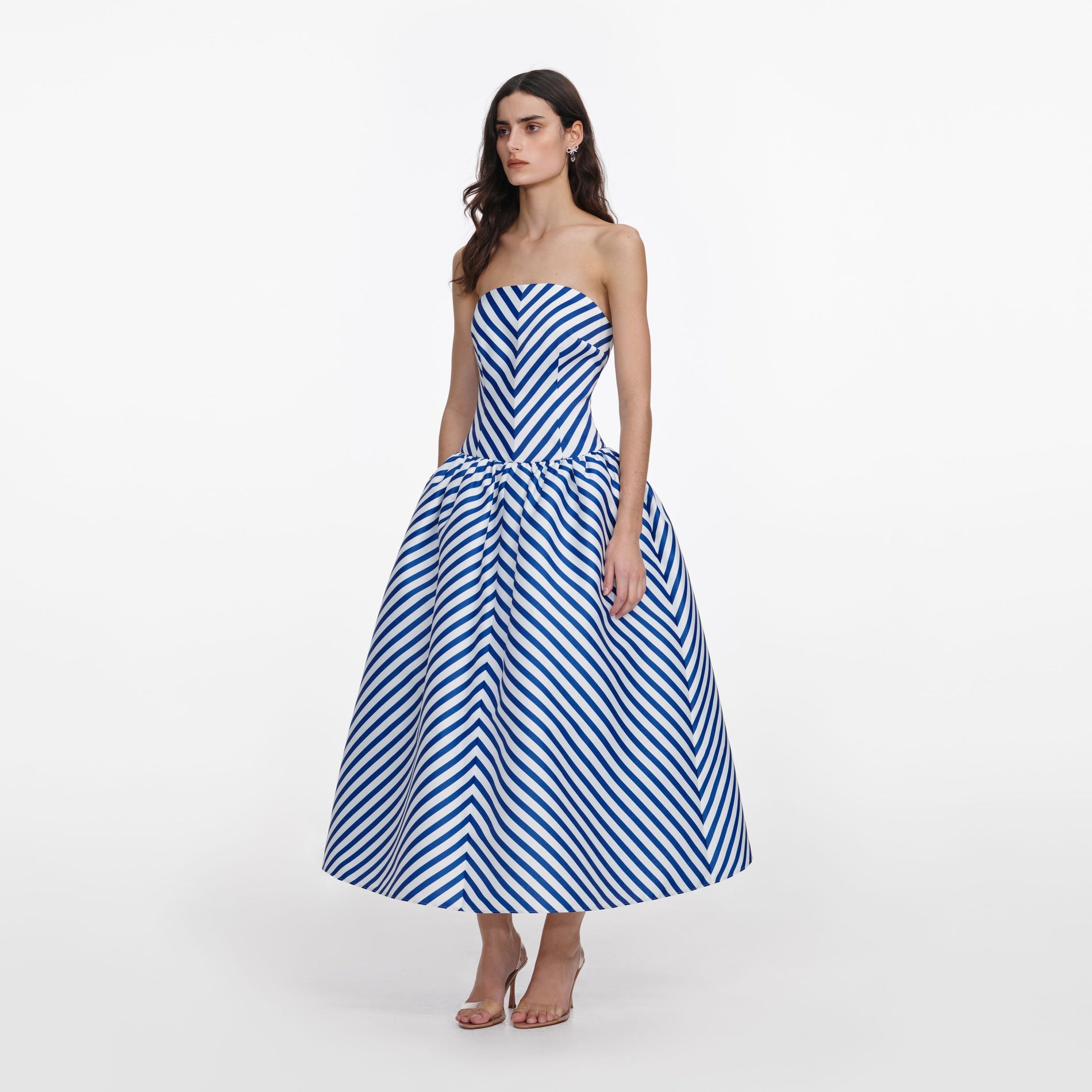 Side view of a woman wearing the Navy Stripe Taffeta Midi Dress