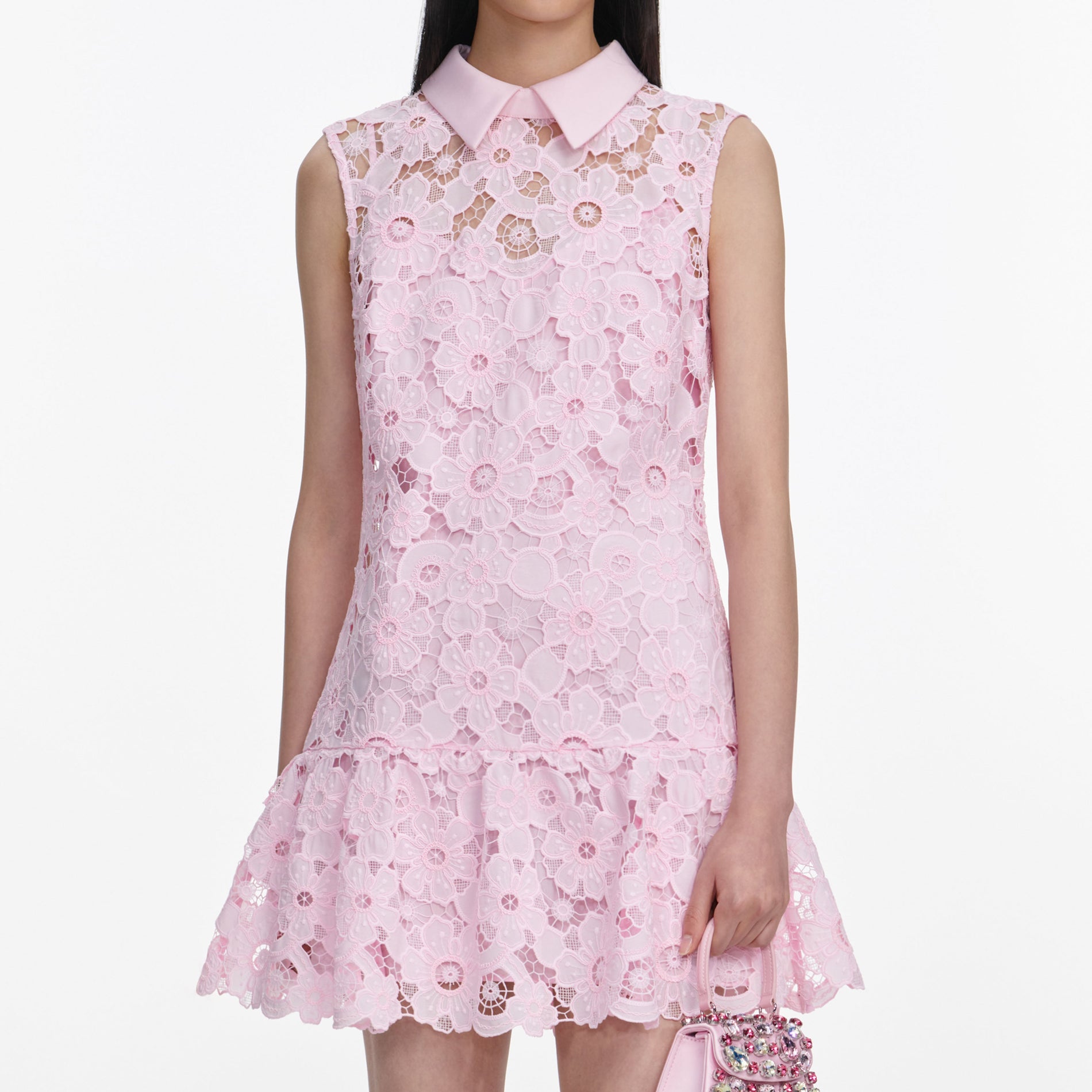 A close up of a woman wearing the Pink Lace Collared Mini Dress