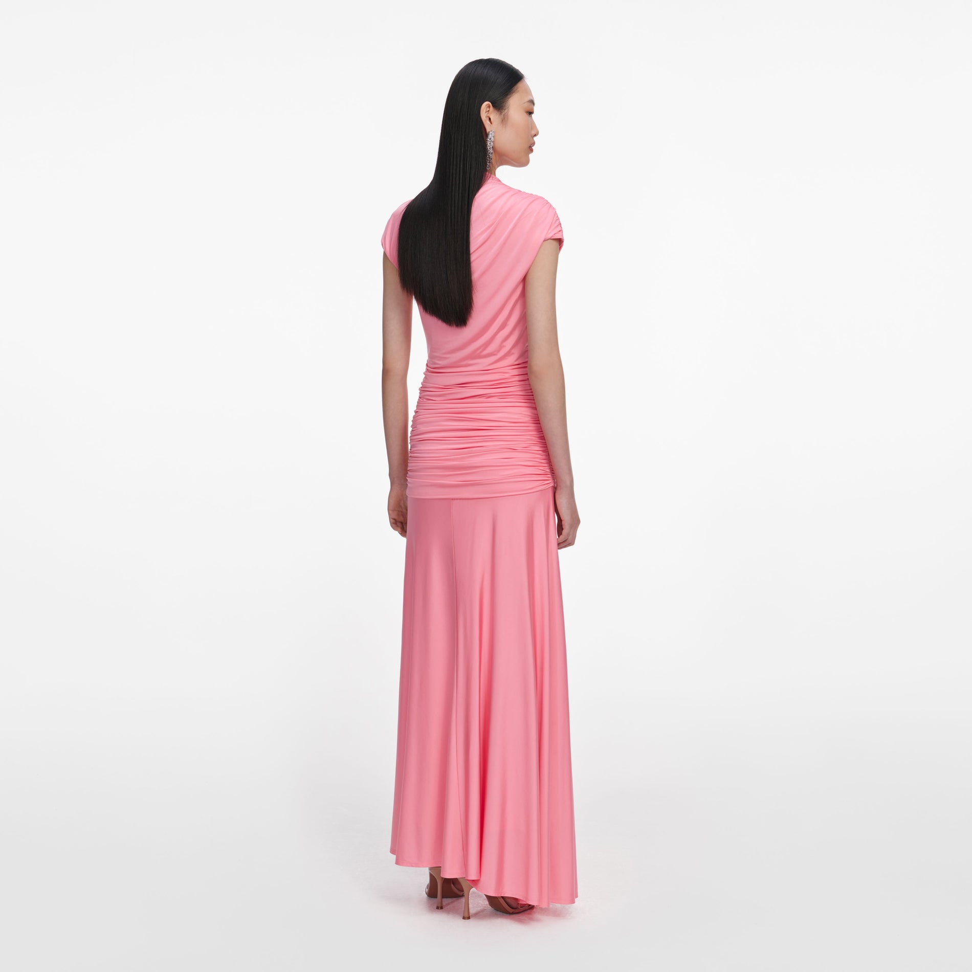 Back view of a woman wearing the Pink Jersey Gathered Maxi Skirt