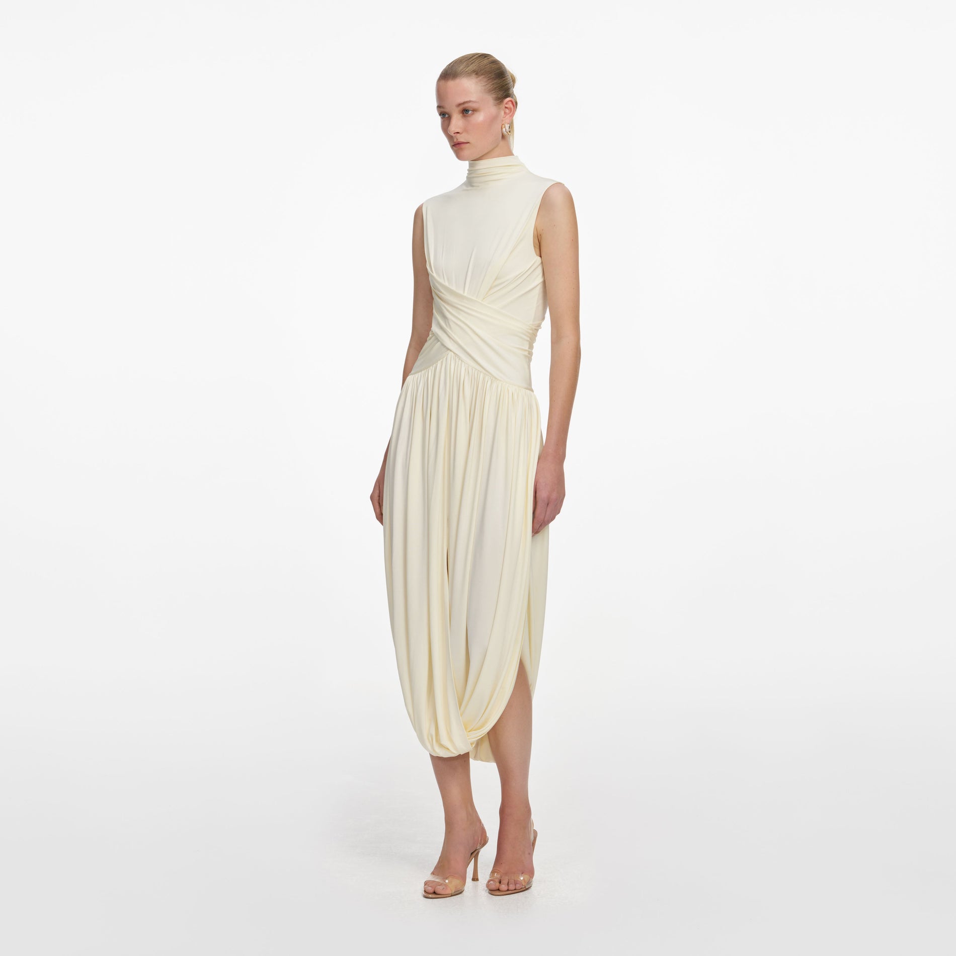 Side view of a woman wearing the Yellow Jersey Wrap Midi Dress