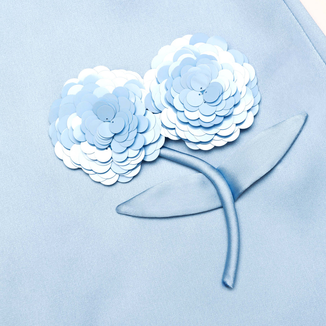 A close up of the fabric for the Blue Satin 3D Sequin Flower Mini Skirt