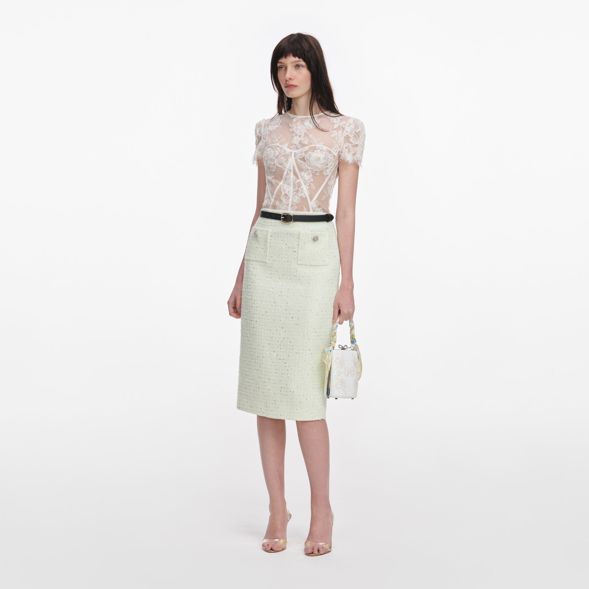 Side view of a woman wearing the Cream Sequin Lace Top