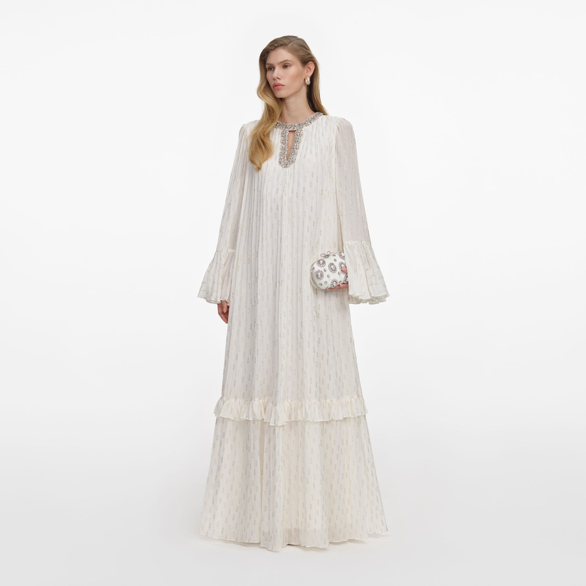 Side view of a woman wearing the Cream And Gold Chiffon Maxi Dress