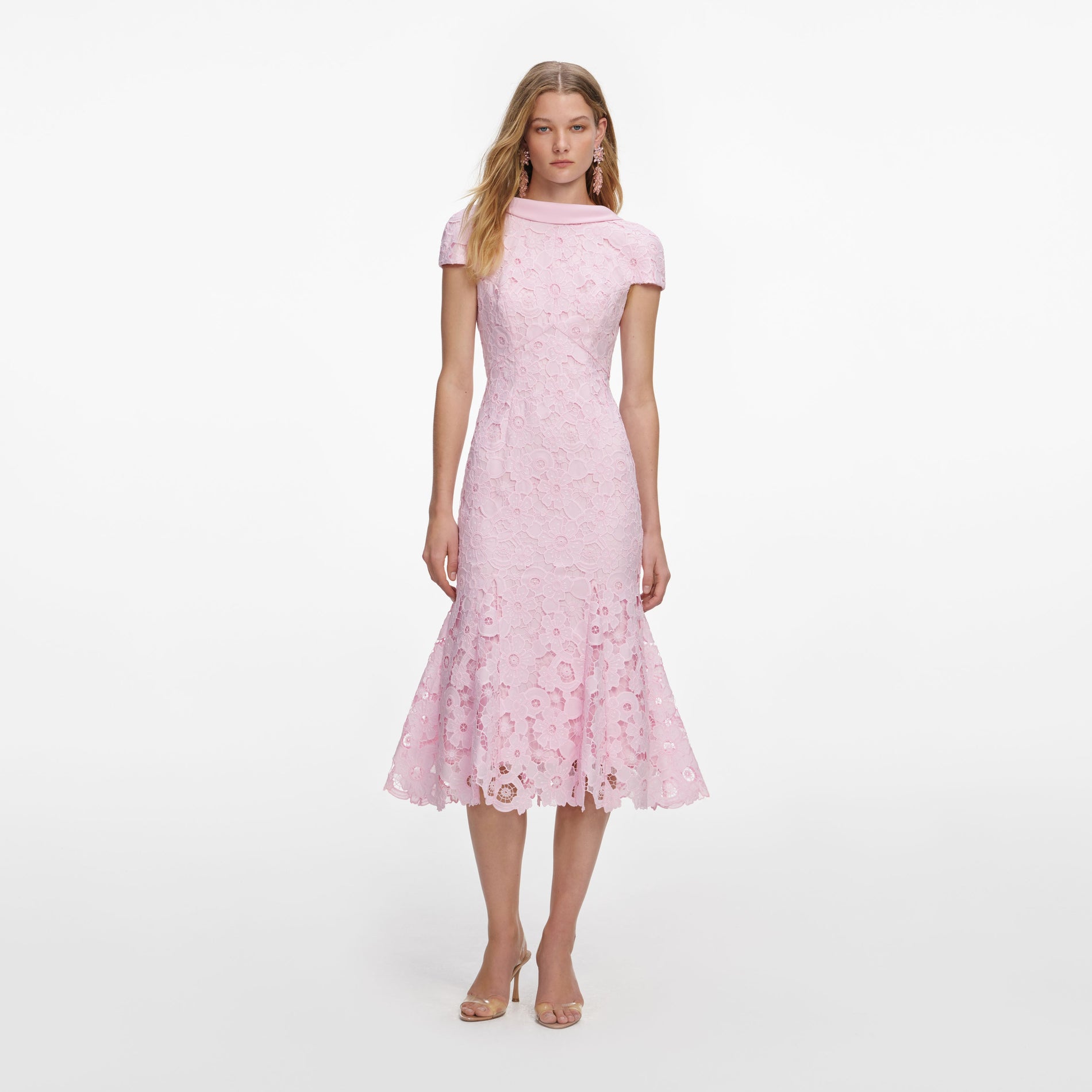 Front view of a woman wearing the Pink Lace Scoop Back Midi Dress