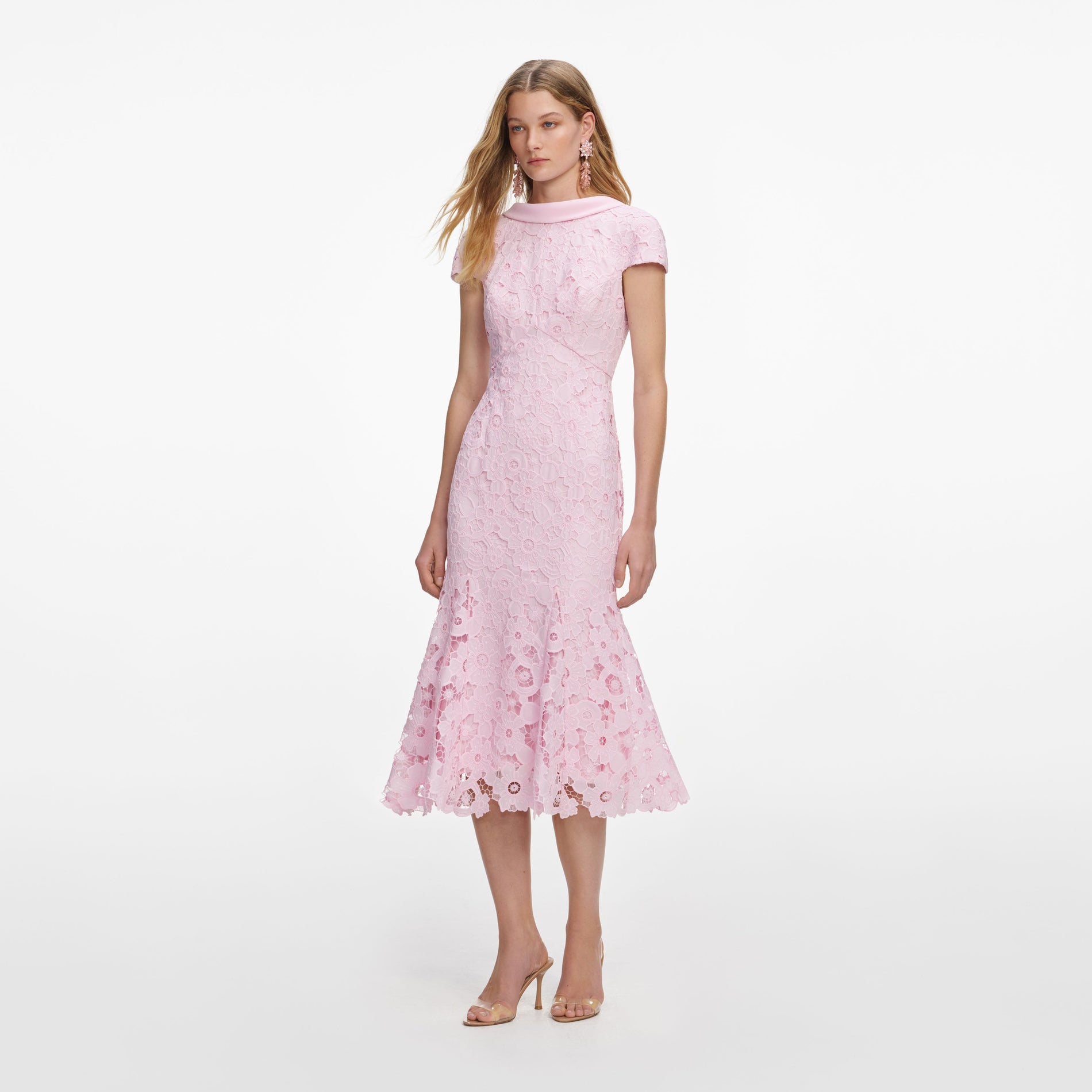 Side view of a woman wearing the Pink Lace Scoop Back Midi Dress