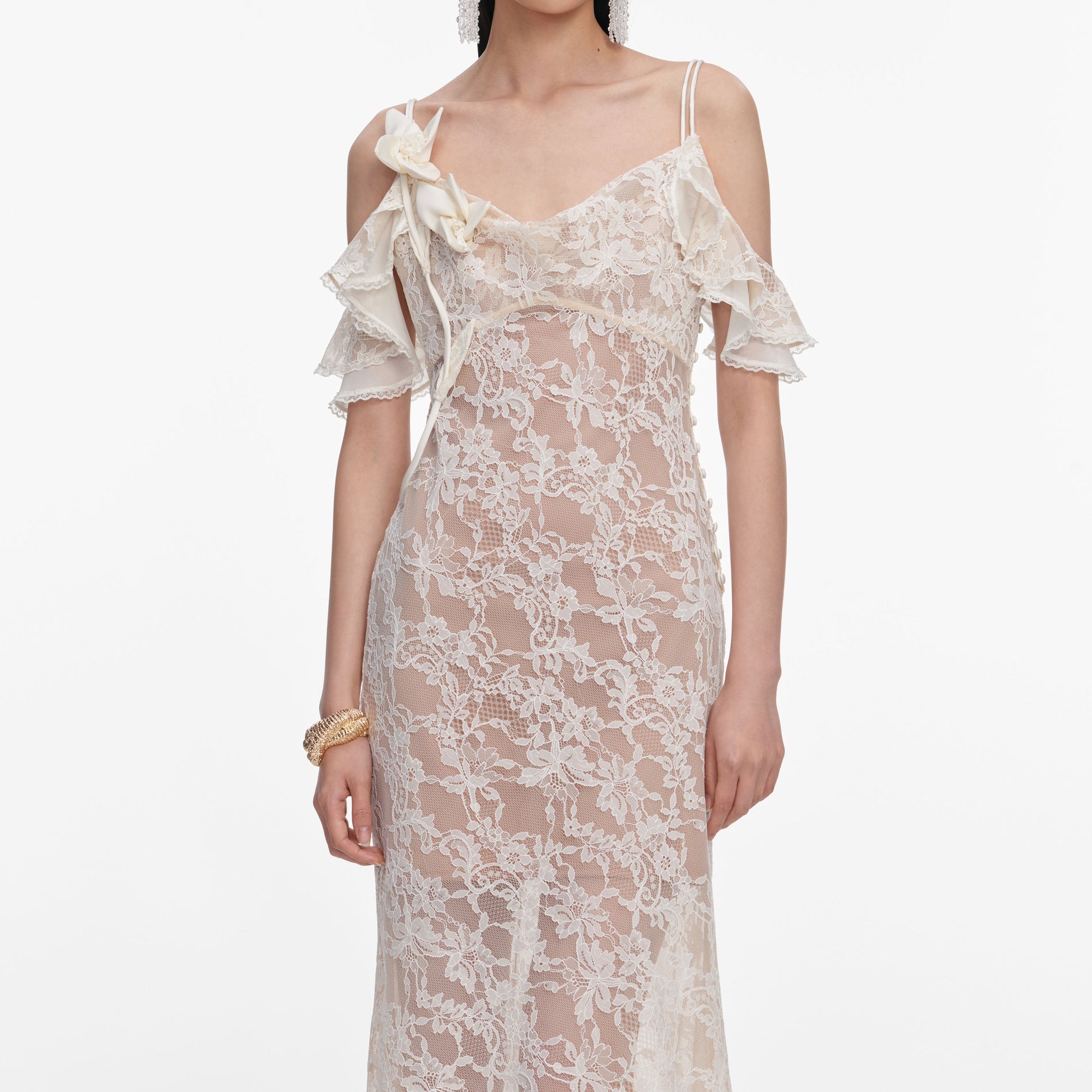 A close up of a woman wearing the Cream Lace Flower Maxi Dress