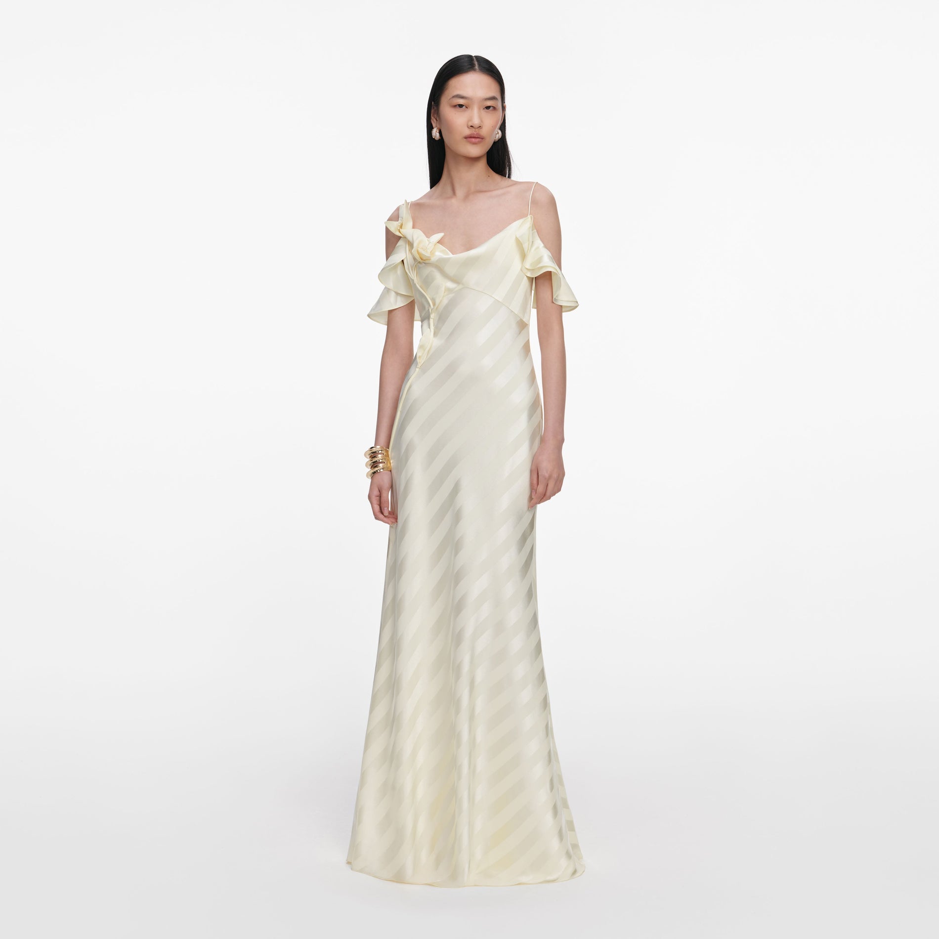 Front view of a woman wearing the Yellow Satin Striped Maxi Dress