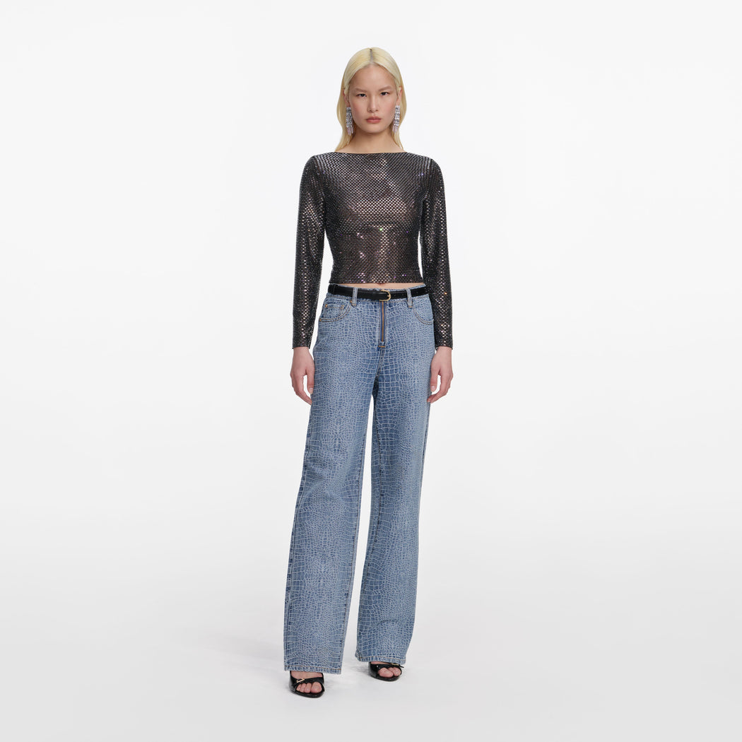 Front view of a woman wearing the Croc Effect Straight Leg Jeans