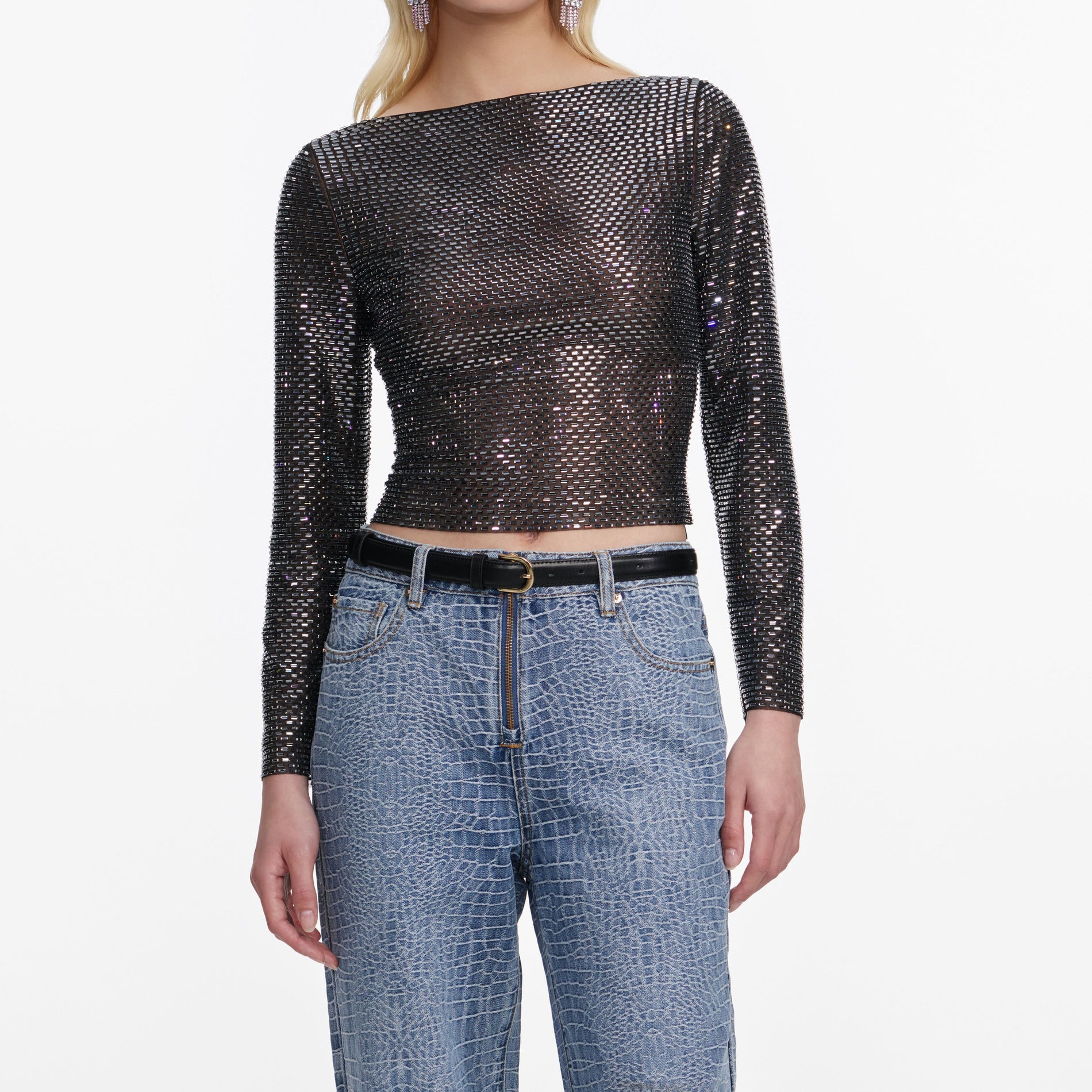 A close up of a woman wearing the Croc Effect Straight Leg Jeans