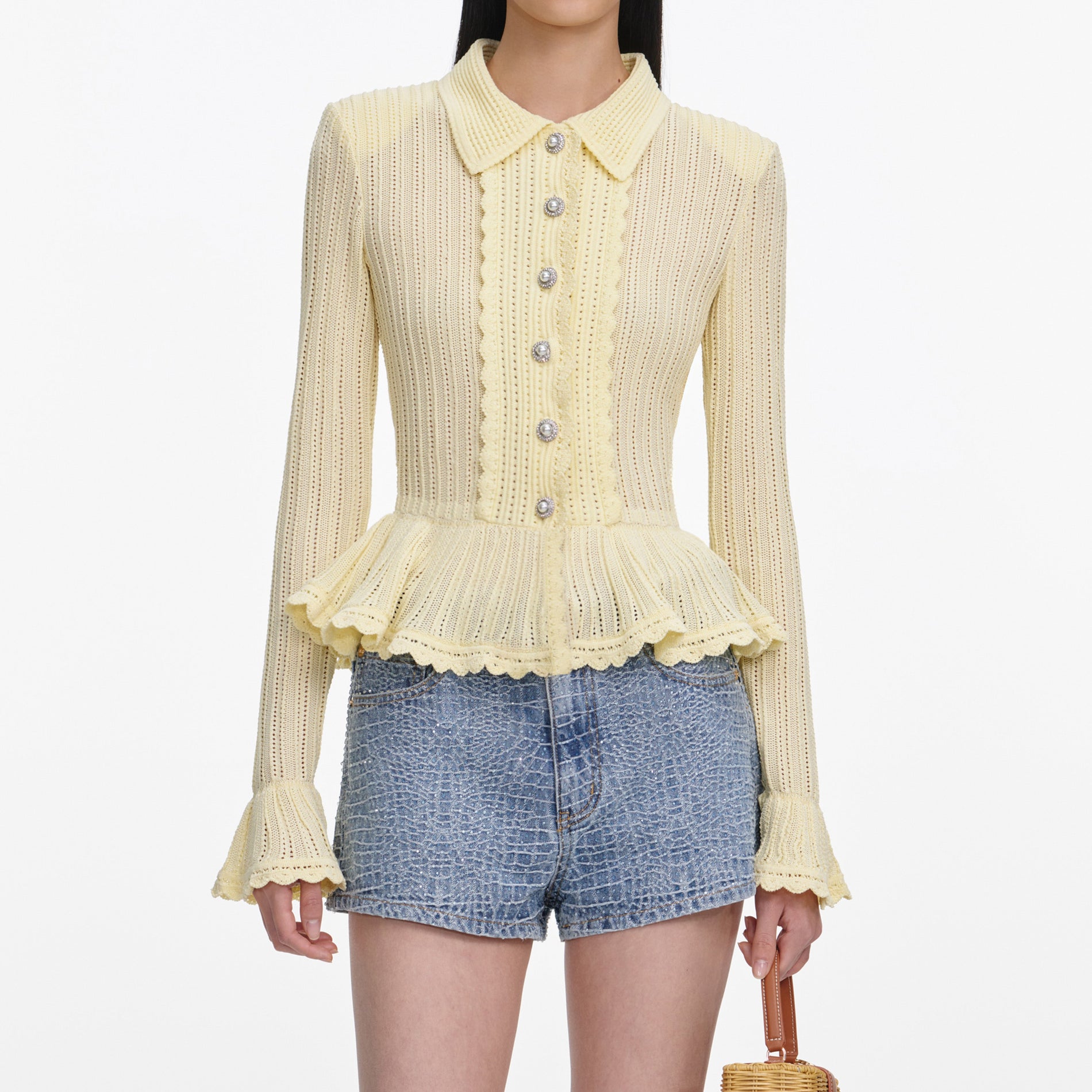 A close up of a woman wearing the Rhinestone Croc Effect Denim Shorts