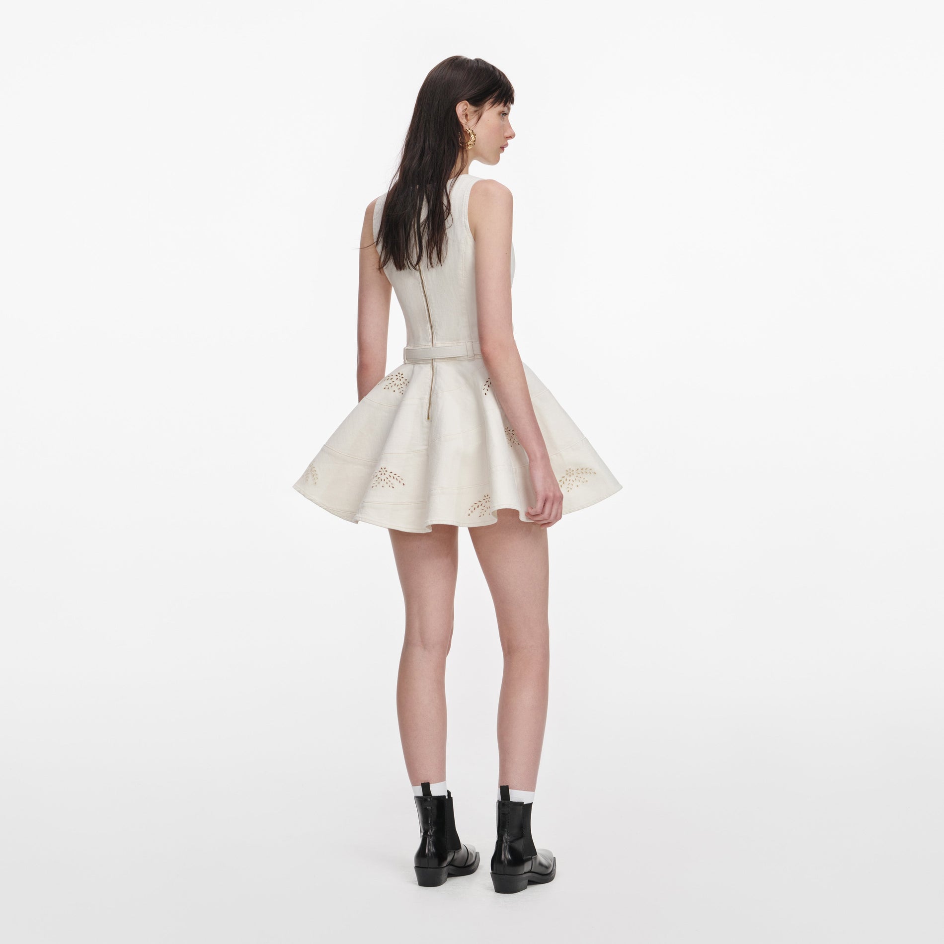 Back view of a woman wearing the Cream Broderie Denim Sleeveless Mini Dress