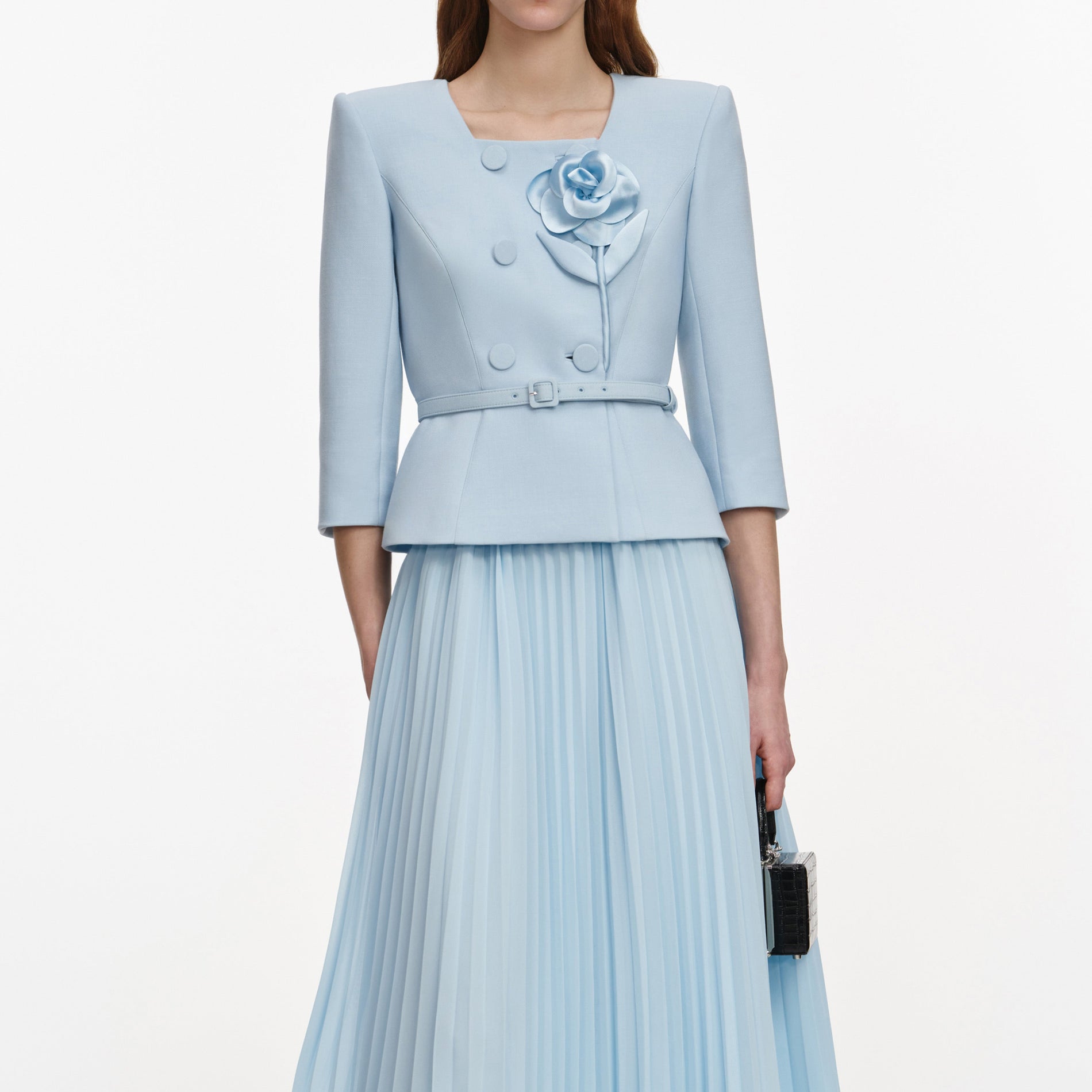 A close up of a woman wearing the Blue 3D Flower Chiffon Midi Dress