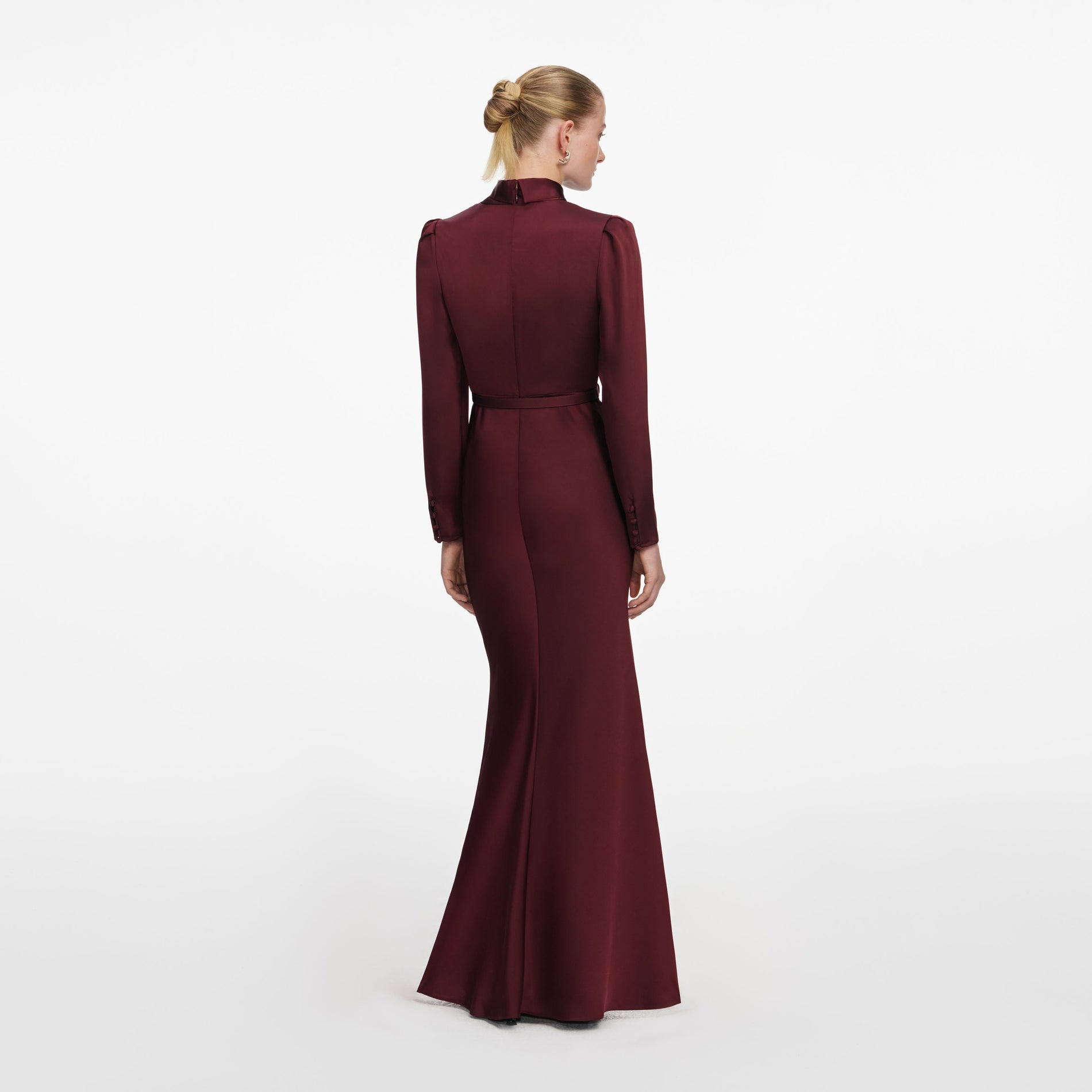 Back view of a woman wearing the Burgundy Tie Neck Satin Maxi Dress