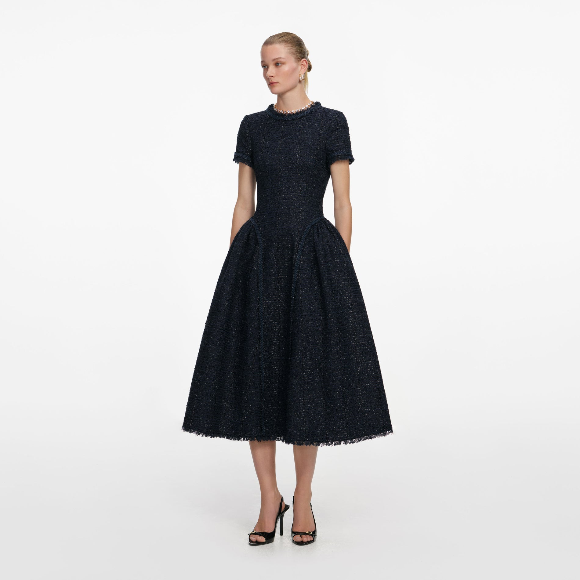 Side view of a woman wearing the Navy Metallic Boucle Midi Dress