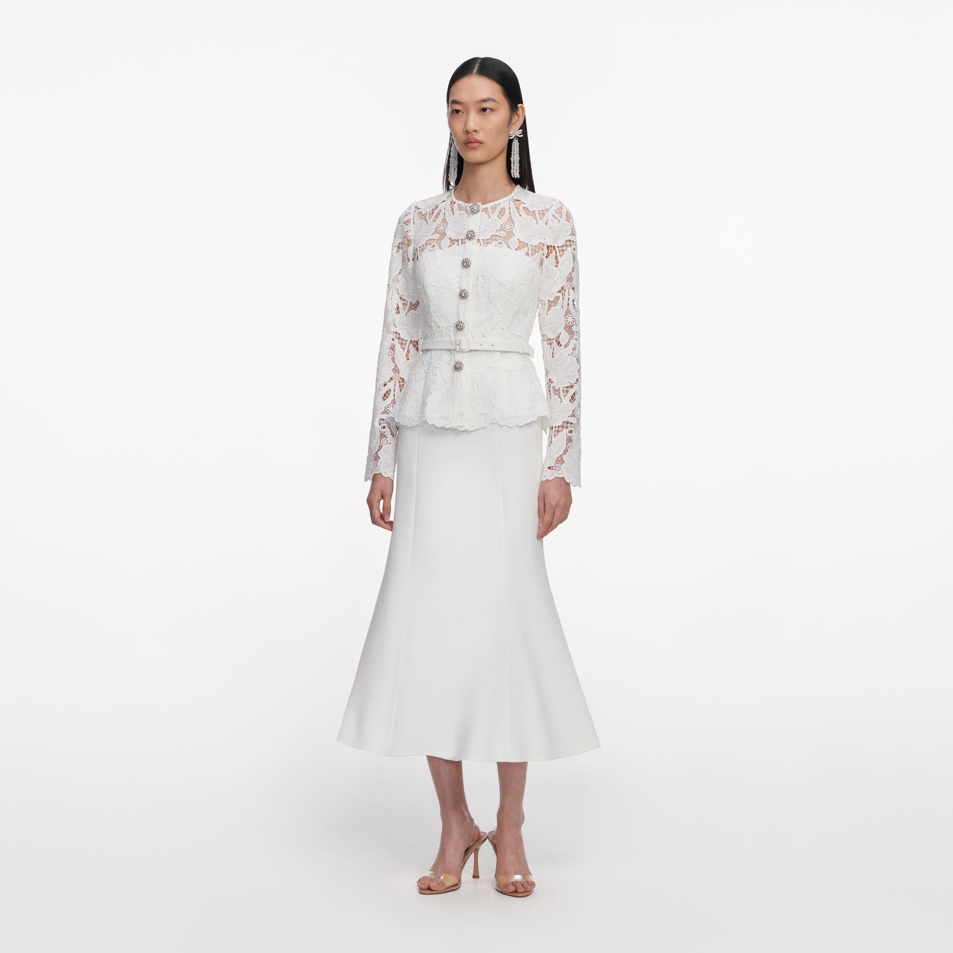 Side view of a woman wearing the White Lace Crepe Midi Dress