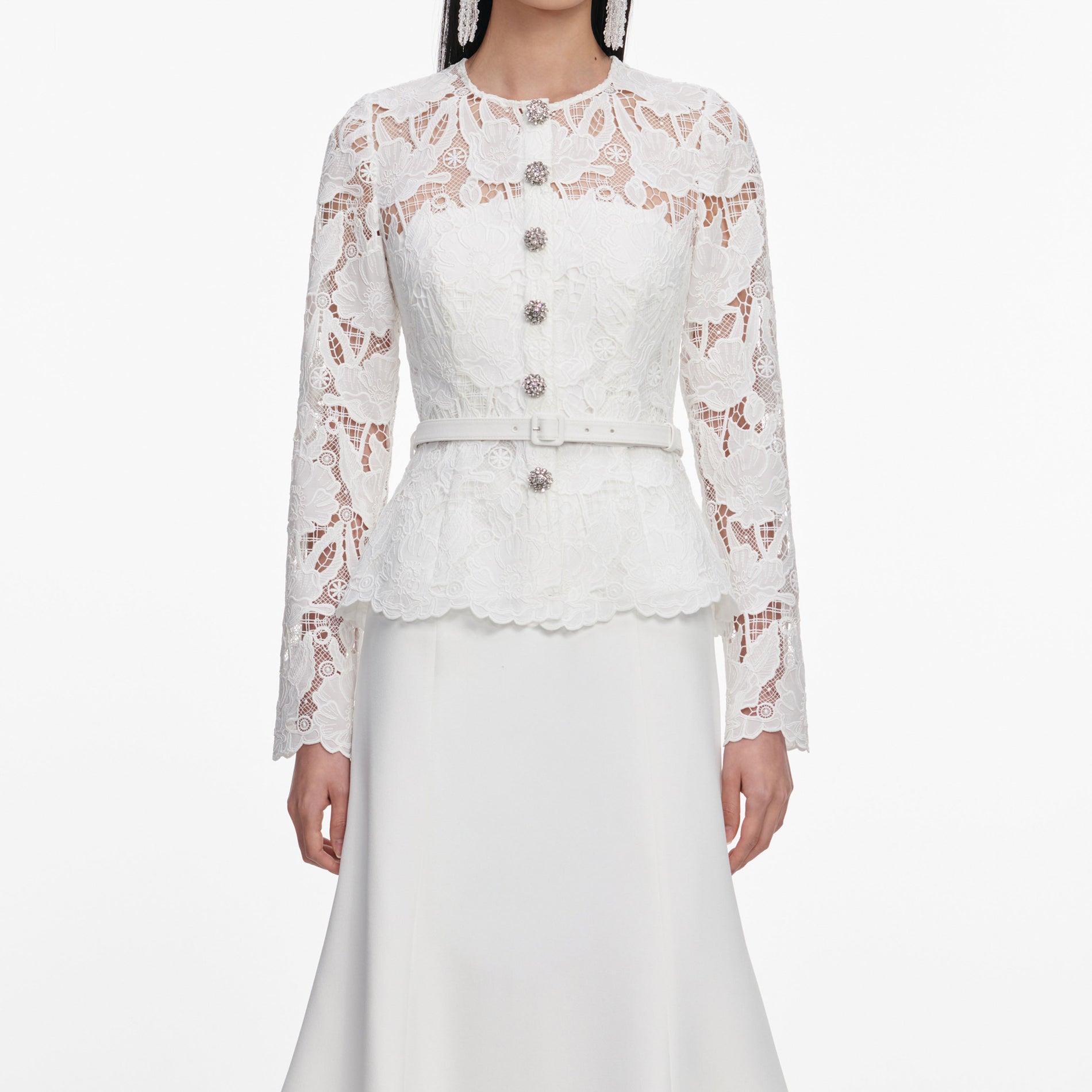 A close up of a woman wearing the White Lace Crepe Midi Dress