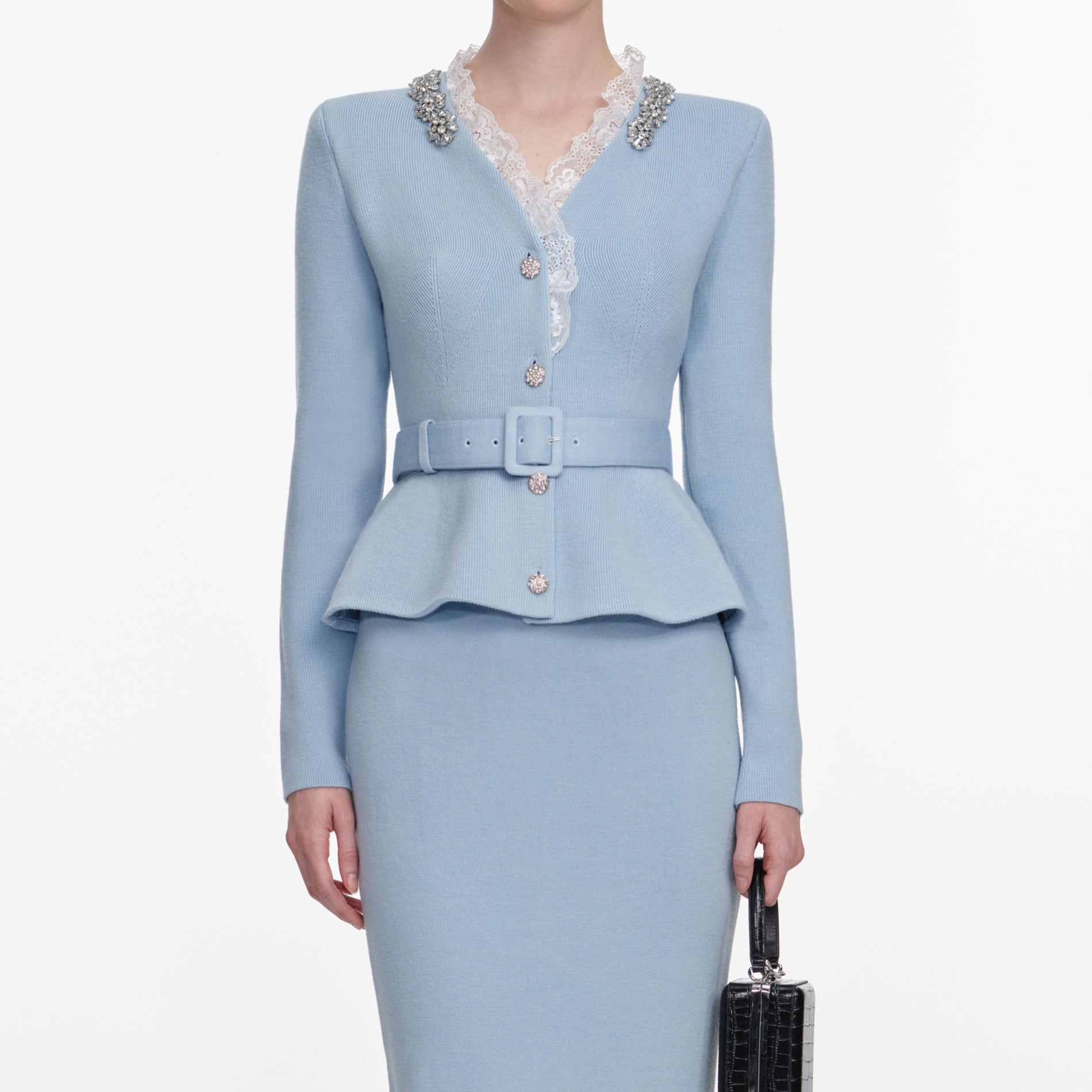 A close up of a woman wearing the Blue Crystal Trim Knit Midi Dress