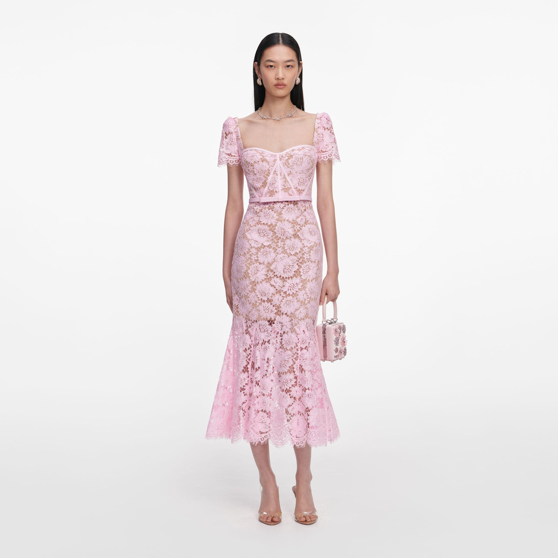 Front view of a woman wearing the Pink Fine Lace Midi Dress