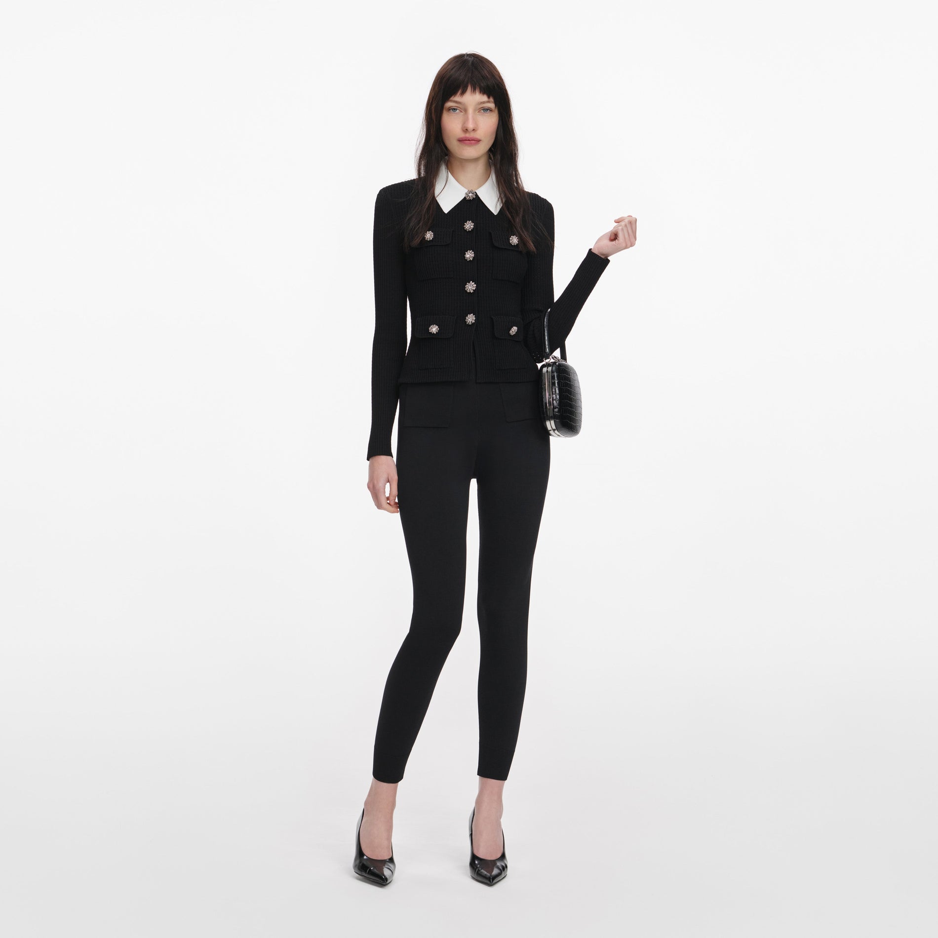 Front view of a woman wearing the Black Tailored Knit Top