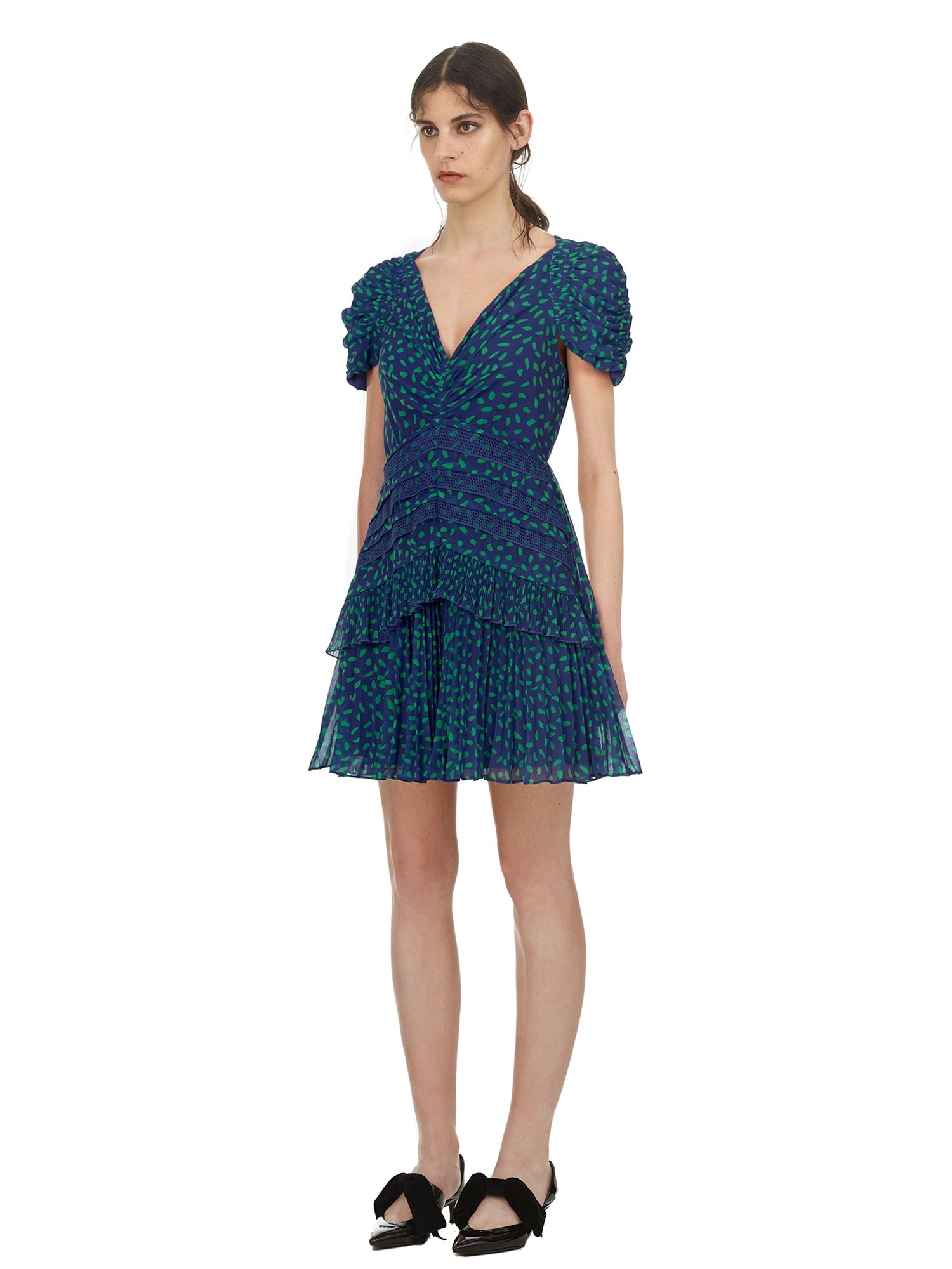 Side view of a woman wearing the Blue and Green Dot Chiffon Printed Dress