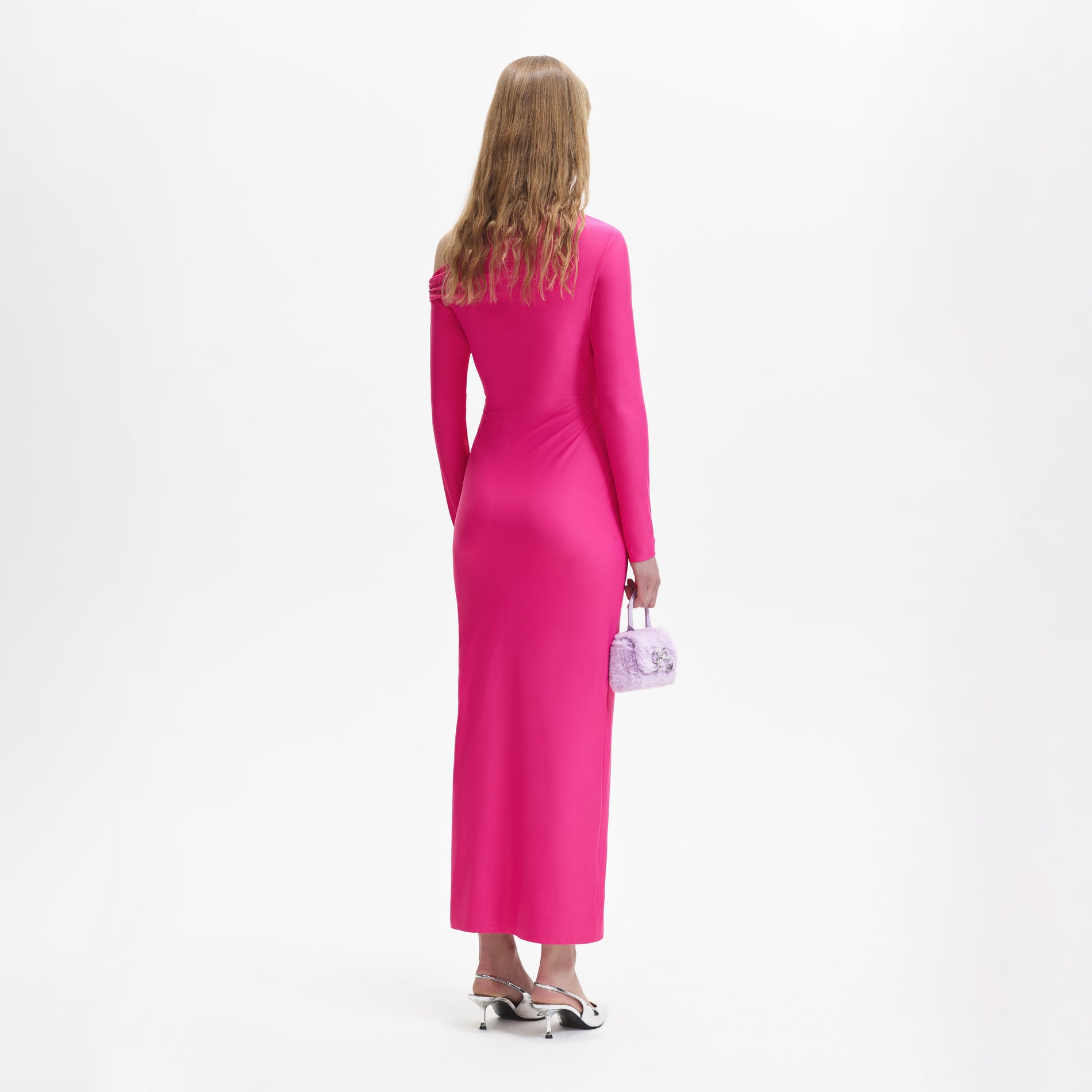 A woman wearing the Pink Jersey Cut Out Maxi Dress