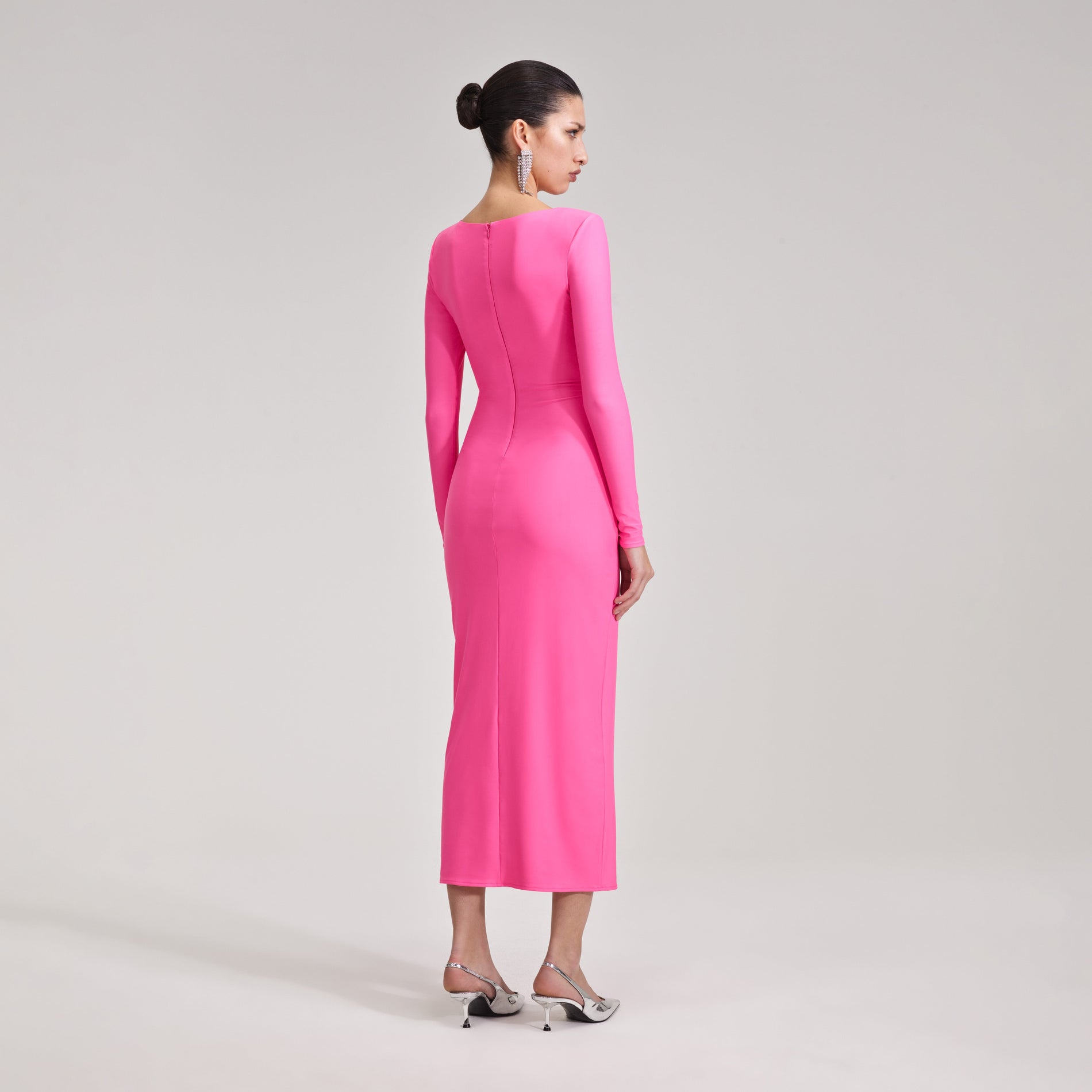 A woman wearing the Pink Jersey Midi Dress