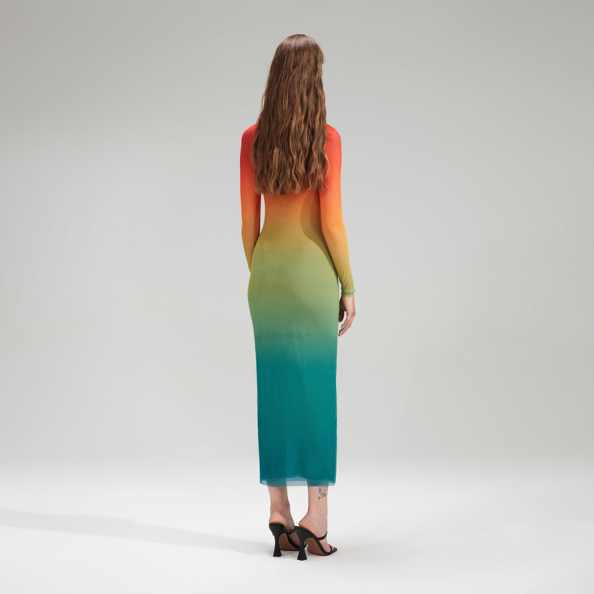 A woman wearing the Ombre Mesh Midi Dress
