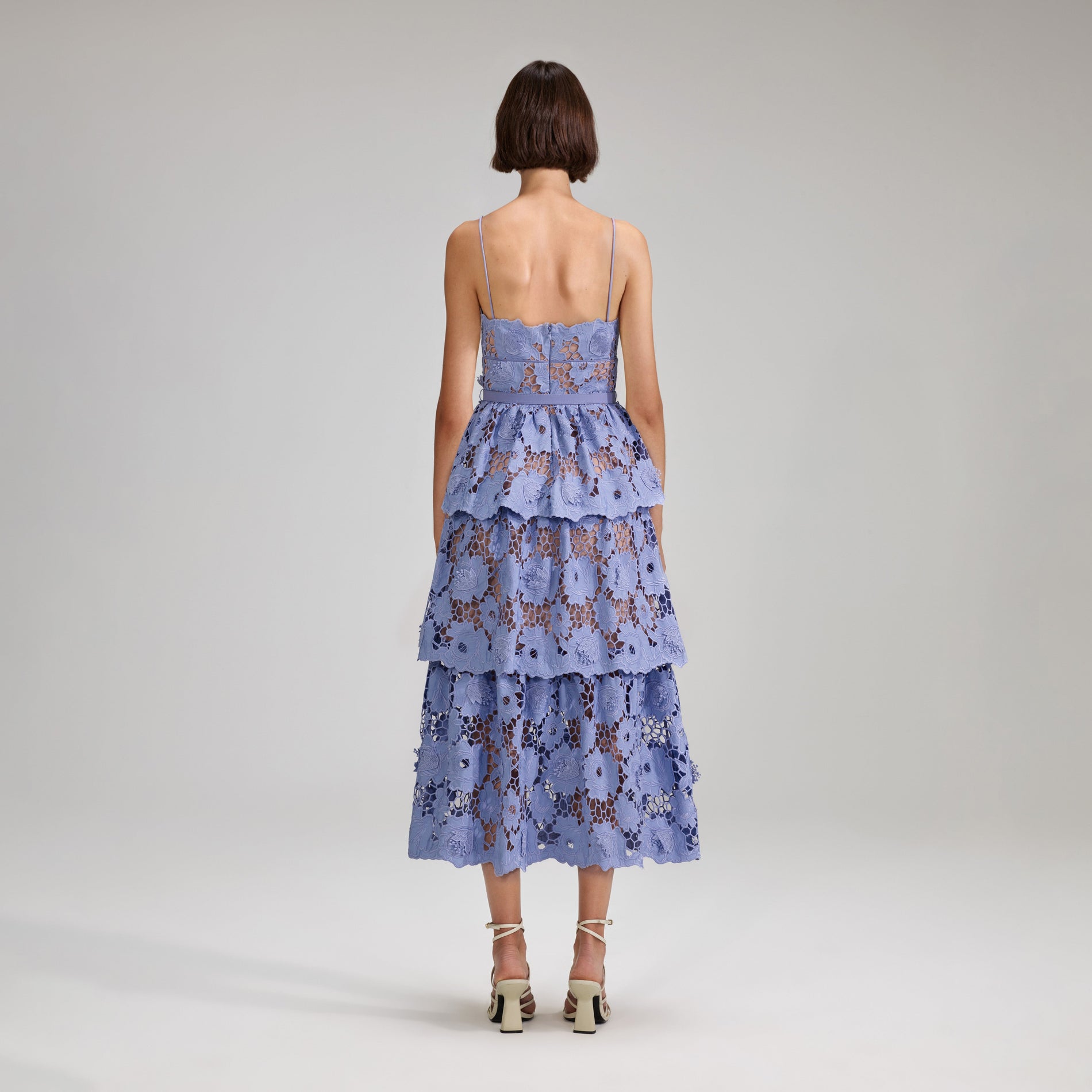 A woman wearing the Lilac 3D Cotton Lace Midi Dress