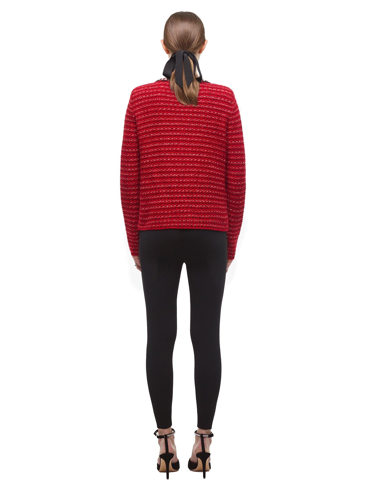 A woman wearing the Oversized Red Melange Knit Cardigan